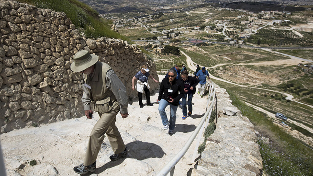 ARCHAEOLOGY-HERODIUM/ Tourists visit Herodium, where Herod's fortress palace once stood, south of the West Bank city of Bethlehem March 31, 2015. Israeli archaeologists have recently uncovered a grand arched walkway built by Herod the Great at his palace of Herodium that sheds more light on the formidable building projects of the Jewish Roman king. After the palace-fort was completed, Herod appears to have changed his mind and he ordered the entire mound, including the walkway, to be buried under rubble and it remained hidden un