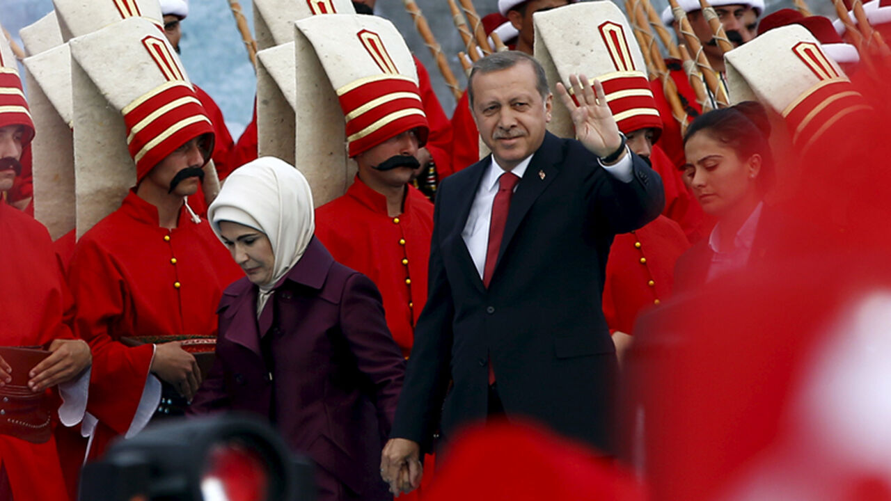 TURKEY-ANNIVERSARY/ Turkish President Tayyip Erdogan, accompanied by his wife Emine Erdogan (L), greets his supporters as he arrives at the a ceremony to mark the 562nd anniversary of the conquest of the city by the Ottoman Turks, in Istanbul, Turkey, May 30, 2015. REUTERS/Murad Sezer - RTR4Y59A