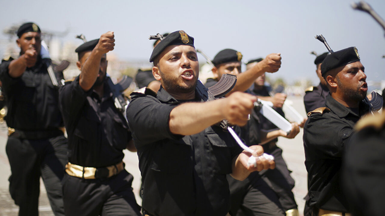 Palestinian policemen loyal to Hamas march during a military graduation ceremony in Gaza City June 16, 2015. REUTERS/Suhaib Salem



 - RTX1GOO1