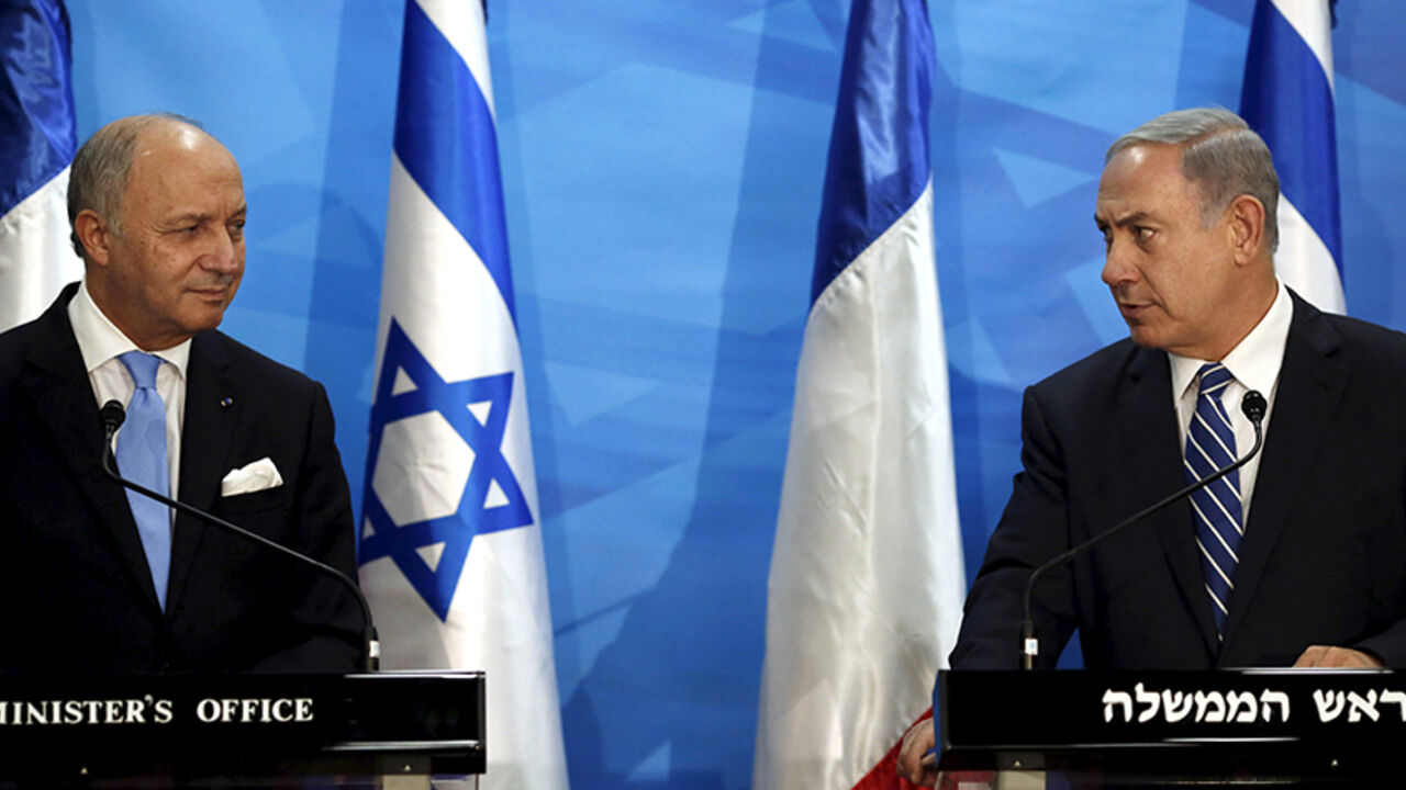 ISRAEL-PALESTINIANS/FRANCE Israel's Prime Minister Benjamin Netanyahu (R) and France's Foreign Minister Laurent Fabius deliver statements in Jerusalem June 21, 2015. Netanyahu prefaced talks about a French-led peace initiative on Sunday by saying foreign powers were trying to dictate to Israel a deal with the Palestinians. Fabius is promoting a French-led initiative that would see the Israeli-Palestinian peace process, which collapsed in 2014, relaunched through an international support group comprising Arab states, the European Unio