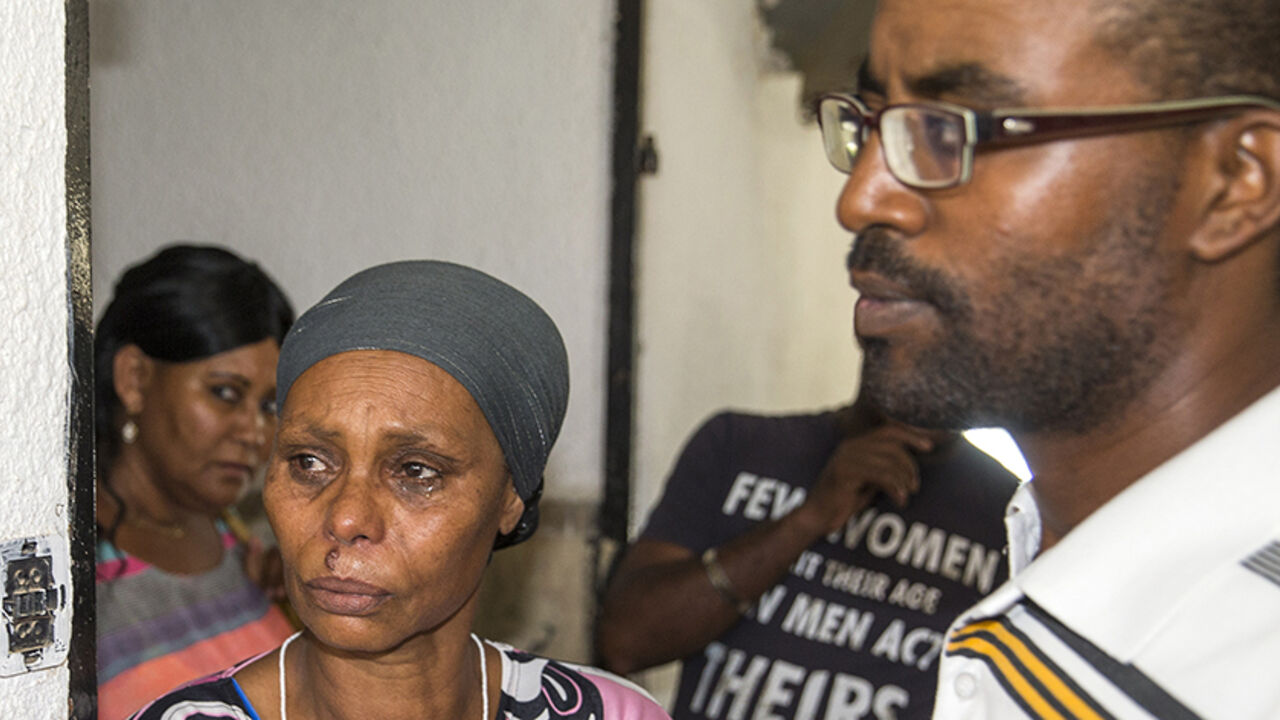 Nic6467328 The brother and mother of Avraham Mengistu, 29, an Israeli of Ethiopian descent who is reportedly held captive in the Gaza Strip, stand during a press conference in the southern city of Ashkelon on July 9, 2015, in which they called on Hamas to release his brother and the Israeli government to work toward his safe return. Two Israelis are being held captive in the Gaza Strip, including one detained by Hamas after crossing into the territory last year, Israeli officials said, raising fears of another hostage