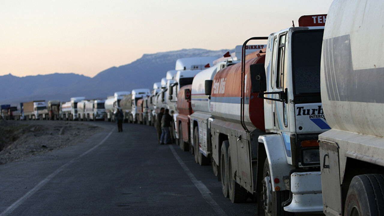 TURKEY-IRAQ/CONFLICT Turkish trucks and tankers, shuttling between Turkey and Iraq, queue on a road leading to the Habur border gate in southeastern Turkey, before crossing into Iraq with their goods, February 23, 2008. Turkey's exports to Iraq jumped nine percent last year to $2.8 billion and its influence can be felt across northern Iraq in the form of supermarkets, consumer goods, construction firms and traders from all over Turkey. To match feature TURKEY-IRAQ/CONFLICT REUTERS/Fatih Saribas (TURKEY) REUTERS/Fatih Saribas