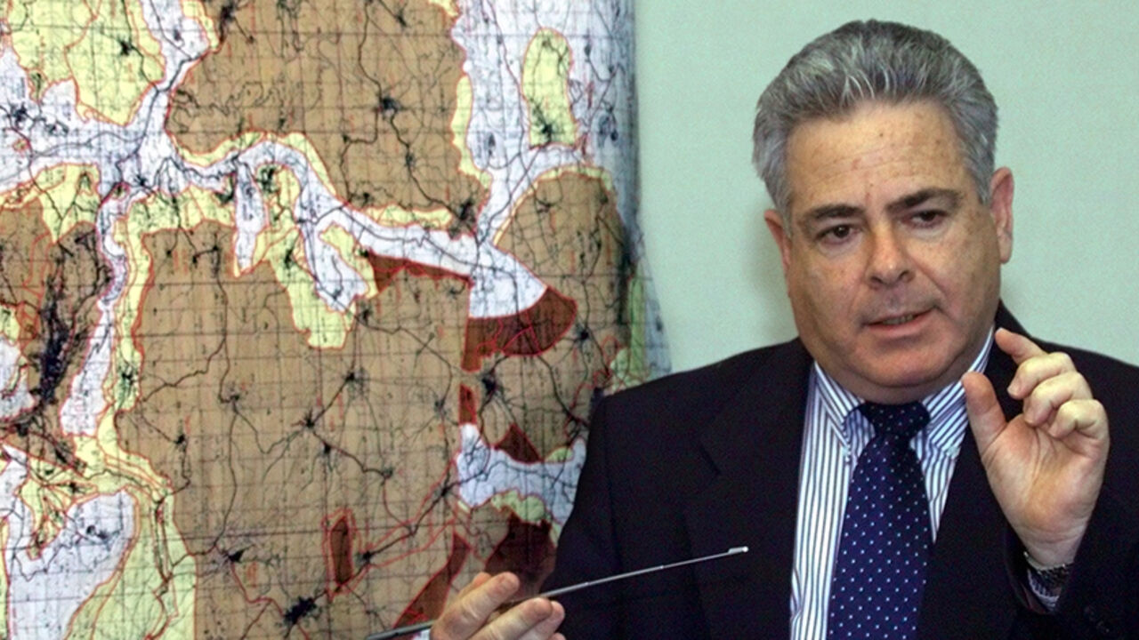 MIDEAST HANDOVER Deputy Defense Minister Ephriam Sneh in front of a large map of the West Bank during a press conference March 19 at which he announced the Israeli cabinet decision to go ahead with a further redeployment from 6.1% of West Bank land to be handed over to full Palestinian Authority. control. The dark brown areas show areas to be included in the redeployment in the northern part of the West Bank. The Palestinians will control 60% of their population but only a bit less than 20% of the West Bank land after the 6