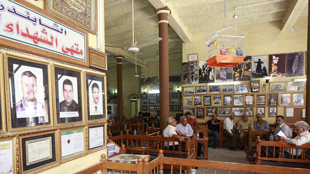 IRAQ-BOOKS Residents gather at the Shabandar Cafe in Baghdad's Mutanabi street April 5, 2011. Reading books, buying books and discussing books are the defining pleasures of being a Baghdad intellectual, and for generations the life of the mind has orbited around this lane, the booksellers' market of the Iraqi capital. Four years ago, in a blow felt deeply by Iraq's intelligentsia, a car bomb killed 26 people here. Now, the street is again open, guarded and seemingly safe, and jammed every Friday with students, profess