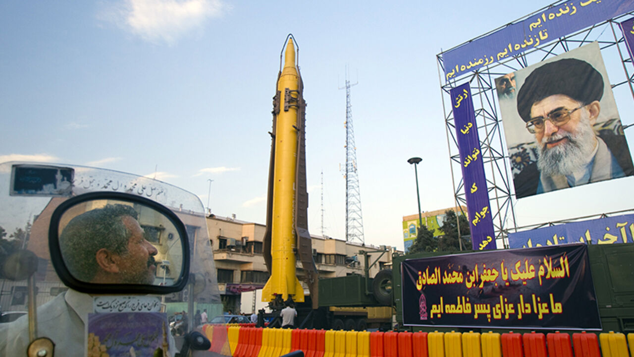 IRAN/ EDITORS' NOTE: Reuters and other foreign media are subject to Iranian restrictions on their ability to film or take pictures in Tehran.
A motorcyclist looks at an Iranian-made Ghadr-F missile during a war exhibition held by Iran's revolutionary guard to mark the anniversary of the Iran-Iraq war (1980-88), also known in Iran as the "Holy Defence", at Baharestan square near the Iranian Parliament in southern Tehran September 23, 2011. A portrait of Iran's Supreme Leader Ayatollah Ali Khamenei is seen on right