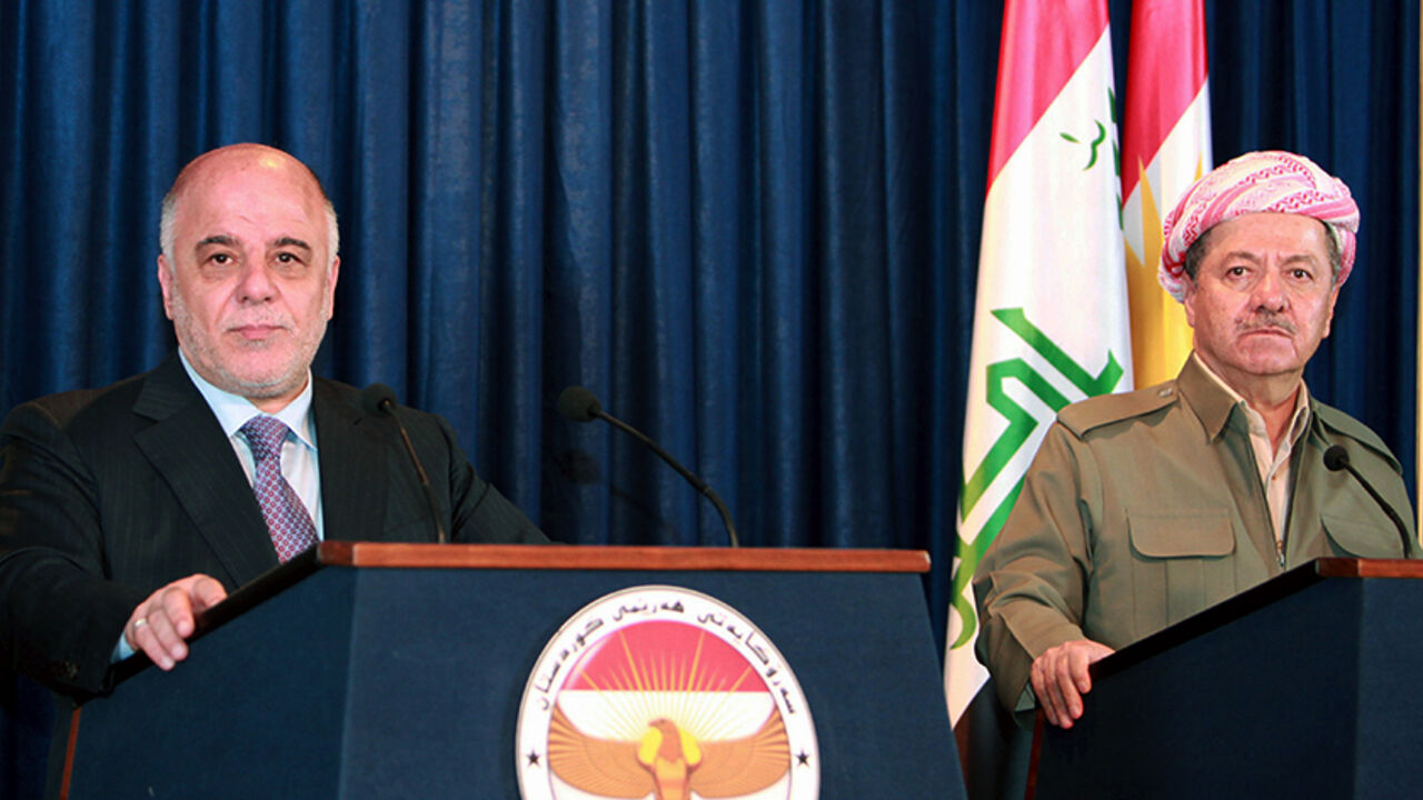 MIDEAST-CRISIS/IRAQ Iraqi Kurdish President Massoud Barzani (R) and Iraqi Prime Minister Haider al-Abadi attend a joint news conference in Arbil April 6, 2015. Abadi said the Baghdad government would work with Kurdish authorities to liberate the northern province of Nineveh from Islamic State militants. REUTERS/Azad Lashkari - RTR4W8W4