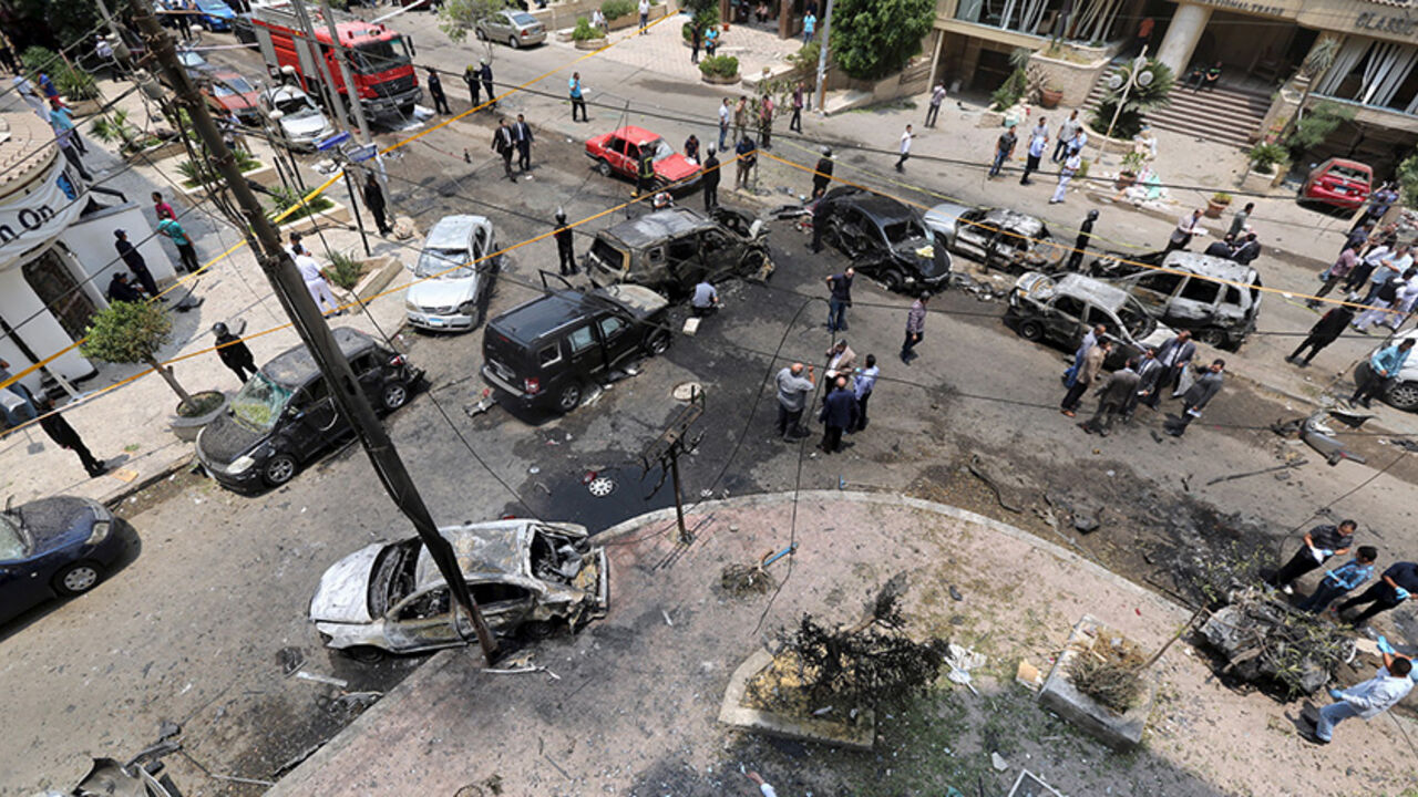 EGYPT-VIOLENCE/ A view shows burnt cars at the site of a car bomb attacked the convoy of Egyptian public prosecutor Hisham Barakat near his house at Heliopolis district in Cairo, Egypt, June 29, 2015. Barakat was injured when a car bomb struck his convoy as it was leaving his home in Cairo on Monday, in a high-profile attack against the judiciary, security and judicial sources said. REUTERS/Mohamed Abd El Ghany - RTX1I937