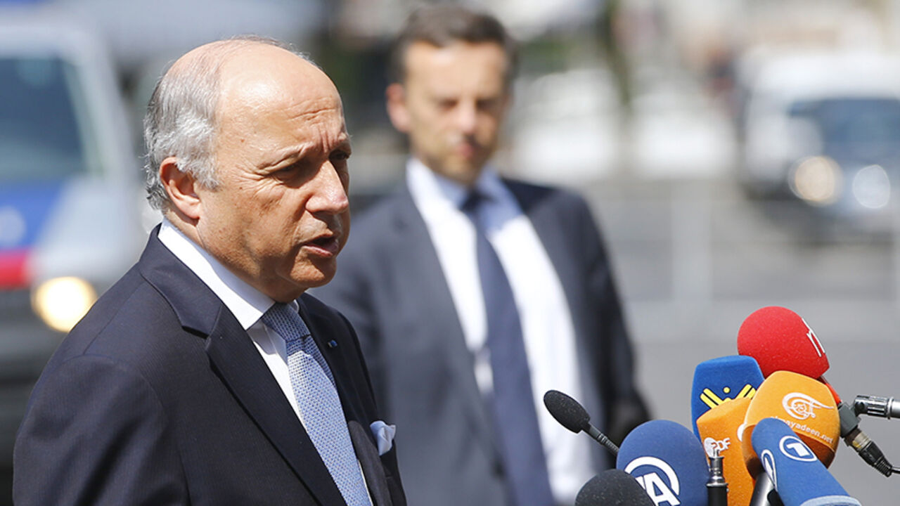 IRAN-NUCLEAR/EU French Foreign Minister Laurent Fabius talks to journalists outside Palais Coburg, the venue for nuclear talks in Vienna, Austria, July 7, 2015. Iran and six major powers will keep negotiating past Tuesday's deadline for a long-term nuclear agreement as they tackle the most contentious issues, including the continuation of a U.N. arms embargo on Iran, the big powers said. REUTERS/Leonhard Foeger - RTX1JEIQ