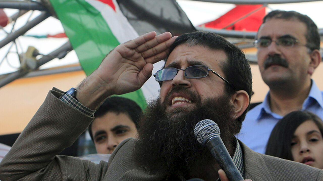 ISRAEL-PALESTINIANS/ Palestinian Islamic Jihad leader Khader Adnan gestures as he speaks during a rally honoring him following his release, near the West Bank city of Jenin July 12, 2015. Israel on Sunday released Adnan from jail following a deal last month in which he agreed to end a 56-day hunger strike, Islamic Jihad sources in the West Bank said. REUTERS/Abed Omar Qusini - RTX1K3PF