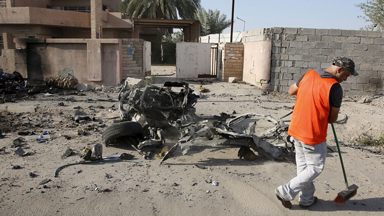 MIDEAST-CRISIS/IRAQ-BOMBS A municipality worker sweeps the ground at the site of a car bomb attack in Baghdad July 13, 2015. Car bombs and suicide attacks targeting mainly Shi'ite Muslim districts of Baghdad killed 35 people on Sunday, one of the heaviest recent tolls in the Iraqi capital, which has faced a wave of bombings by Islamic State militants. REUTERS/Khalid al-Mousily
- RTX1K6JG