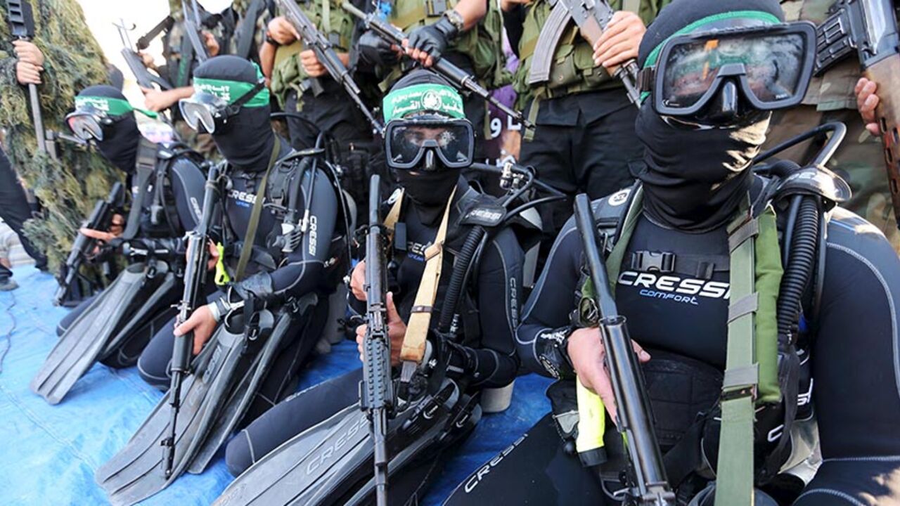 ISRAEL-PALESTINIANS/ Palestinian members of the marine unit of al-Qassam Brigades, the armed wing of the Hamas movement, take part in an anti-Israel parade in Rafah, in the southern Gaza Strip July 13, 2015.
REUTERS/Ibraheem Abu Mustafa
- RTX1K8PX