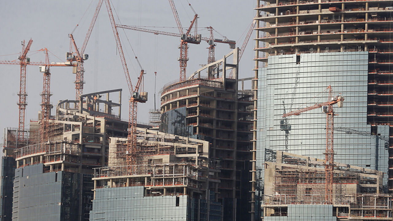 QATAR-FUND/ A view shows the Qatar Petroleum headquarters, which is under construction, in Doha April 8, 2013. Bankers and politicians touting their countries' wares have to work hard to get the attention of Qatar's sovereign wealth fund, such is the range of its interests, from banks to cars to soccer clubs, and its exacting requirement for returns. With estimated assets of about $200 billion, and more than a dozen potential deals on its radar every week, the state-run firm has no time for less than compelling investm