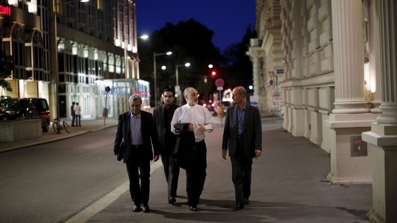 Head of the Iranian Atomic Energy Organization Ali Akbar Salehi (2nd R) walks near the hotel where the Iran nuclear talks meetings are being held in Vienna, Austria in Vienna, Austria Head of the Iranian Atomic Energy Organization Ali Akbar Salehi (2nd R) walks near the hotel where the Iran nuclear talks meetings are being held in Vienna, Austria in Vienna, Austria July 4, 2015. Iran and world powers made progress on future sanctions relief for Iran in marathon nuclear talks on Saturday, but remained divided on issues such as lifting United Nations sanctions and the development of advanced centrifuges. REUTERS/Carlos Barria TPX IMAGES OF THE DAY - RTX1J12P
