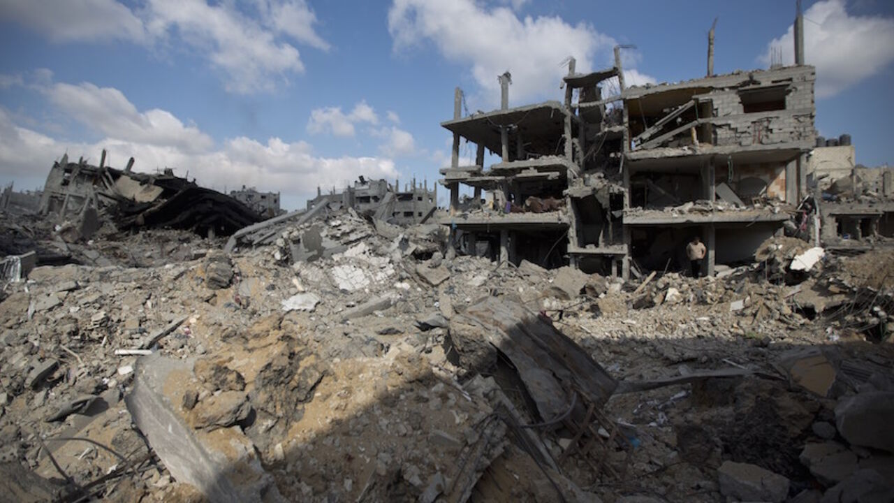 Nic6354475 A view of the rubble of destroyed buildings and homes in the Shejaiya residential district of Gaza City on July 26, 2014. The bodies of at least 35 Palestinians were recovered from rubble across Gaza in the three hours since a humanitarian truce came into effect, raising to over 900 the overall death toll of Israel's onslaught on the territory since July 8, medics said. Thirteen bodies were recovered in Shejaiya in eastern Gaza City, 13 more in Deir al-Balah and Nusseirat in central Gaza, and nine in north