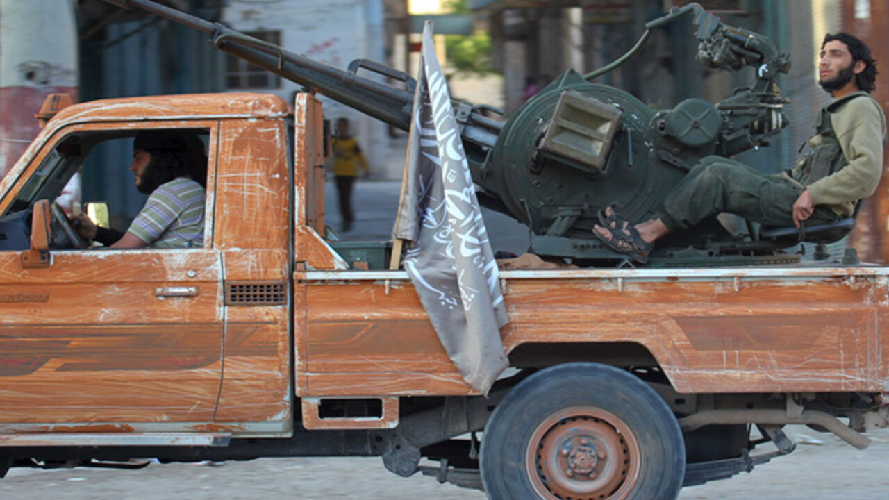 MIDEAST-CRISIS/SYRIA-ARIHA Members of al Qaeda's Nusra Front ride on a pick-up truck mounted with an anti-aircraft weapon in the town of the northwestern city of Ariha, after a coalition of insurgent groups seized the area in Idlib province, May 29, 2015. The Syrian army has pulled back from the northwestern city of Ariha after a coalition of insurgent groups seized the last city in Idlib province in northwestern Syria near the Turkish border that was still held by the government. A coalition of rebel groups called Jaish al Fateh, or