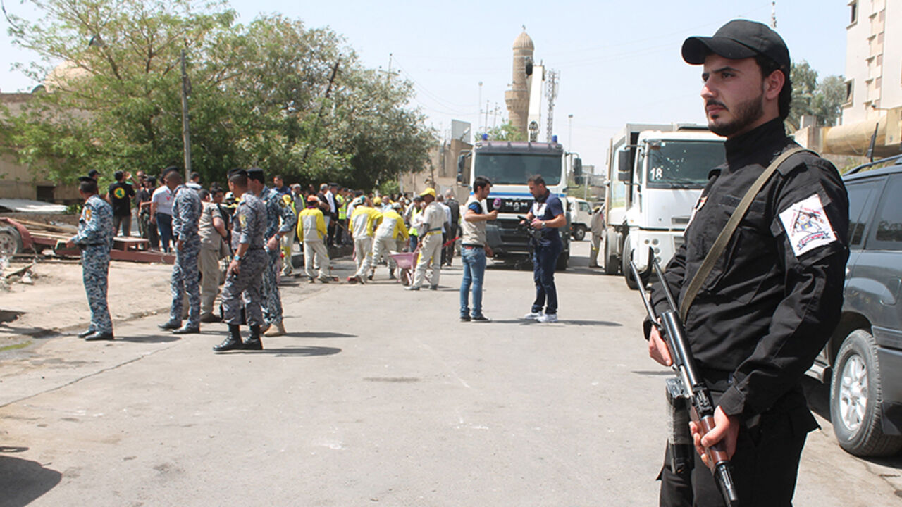 MIDEAST-CRISIS/IRAQ An Iraqi Christian fighter, a member of Babylon Christian Battalion, stands guard near the site of car bomb attack in Baghdad, May 5, 2015. REUTERS/Stringer
- RTX1BOU9
