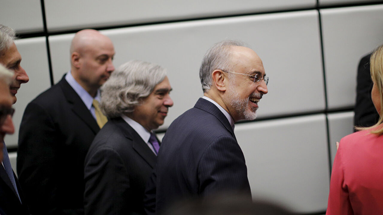 IRAN-NUCLEAR/ The head of the Iranian Atomic Energy Organization Ali Akbar Salehi and U.S. Secretary of Energy Ernest Moniz (3rd R) leave after a group picture at the United Nations building in Vienna, Austria July 14, 2015. Iran and six major world powers reached a nuclear deal on Tuesday, capping more than a decade of on-off negotiations with an agreement that could potentially transform the Middle East, and which Israel called an "historic surrender". REUTERS/Carlos Barria - RTX1KA5B