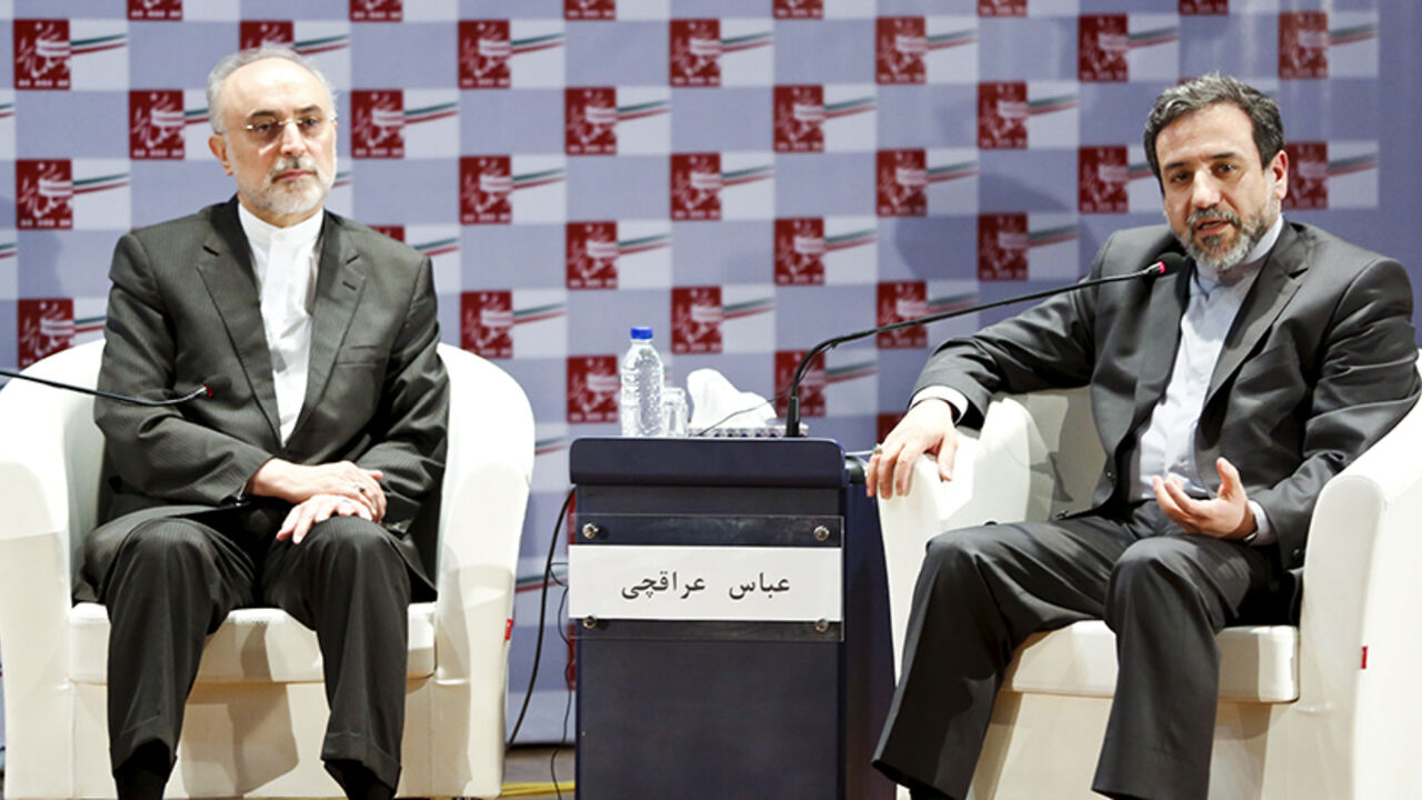 IRAN-NUCLEAR/SANCTIONS Iran's chief nuclear negotiator Abbas Araghchi (R) speaks as the head of the country's Atomic Energy Organization, Ali Akbar Salehi, listens during a nuclear deal review meeting in Tehran August 9, 2015. Dozens of companies tied to Iran's elite Revolutionary Guards, a military force commanding a powerful industrial empire with huge political influence, will win sanctions relief under a nuclear deal agreed with world powers. REUTERS/Raheb Homavandi/TIMA ATTENTION EDITORS - THIS PICTURE WAS PROVIDED BY A THIR
