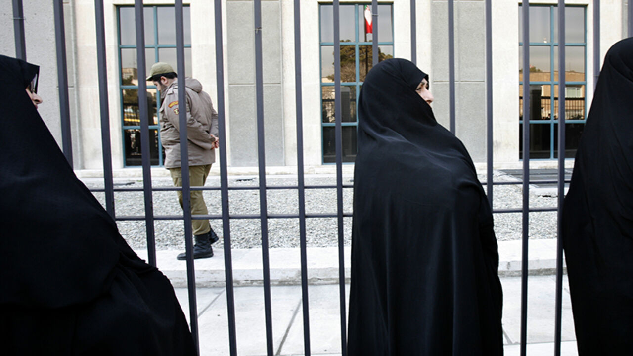 IRAN-RIGHTS/CLASH Iranian teachers protest in front of the parliament building in Tehran March 8, 2007. Iranian police clashed on Thursday with scores of rights activists who gathered in front of parliament to celebrate International Women's Day, one of the activists said. REUTERS/Raheb Homavandi (IRAN) - RTR1N8EO