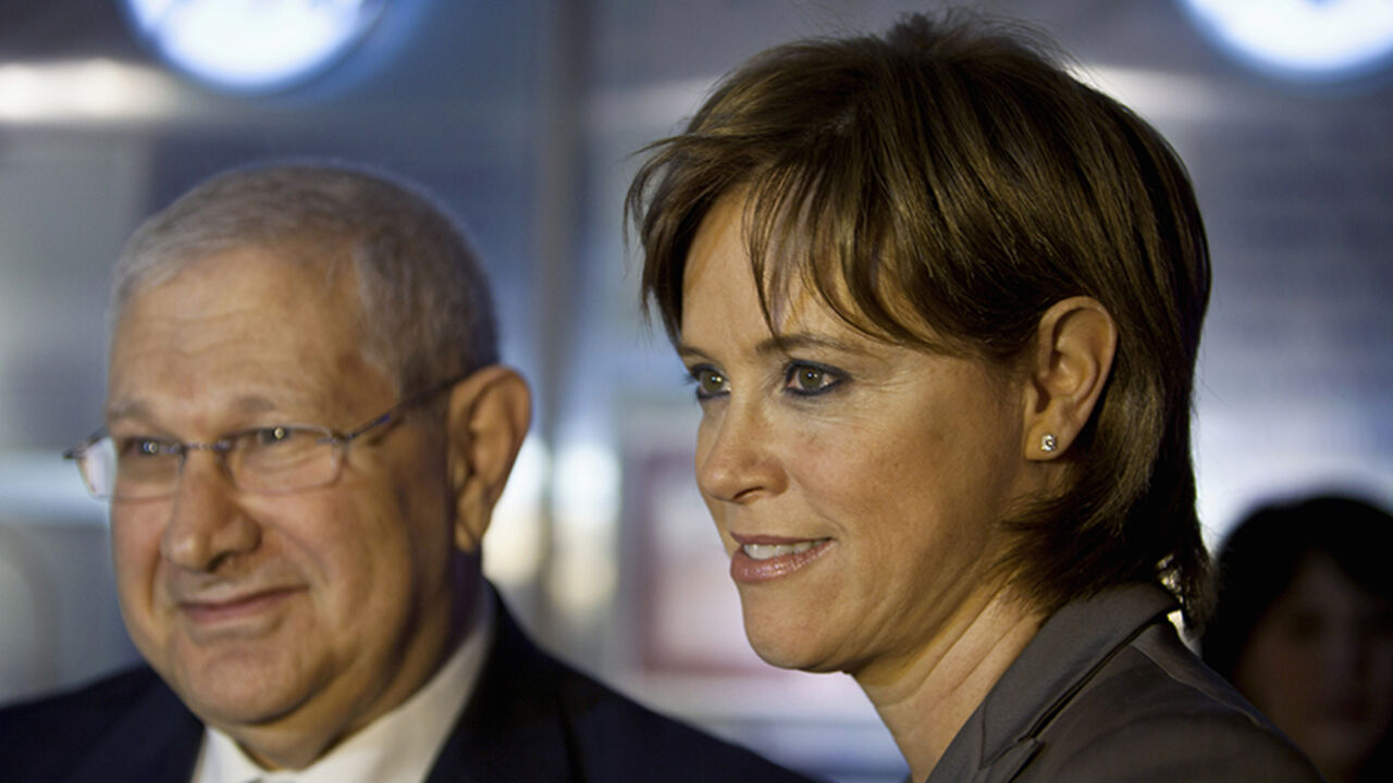 ISRAEL/ Bank Leumi's new CEO Rakefet Russak-Aminoach (R) attends a ceremony to open trading at the Tel Aviv Stock Exchange February 13, 2012. Leumi, Israel's largest bank in terms of assets, named Russak-Aminoach as its new chief executive officer, a month after the bank's veteran head Galia Maor announced plans to resign. The appointment of Russak-Aminoach, 46, a senior deputy to Maor for the past eight years, is subject to regulatory approval and when confirmed would take effect once Maor steps down in May. REUTE