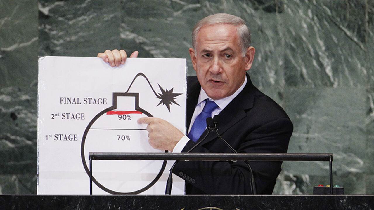 Israel's Prime Minister Benjamin Netanyahu points to a red line he has drawn on a graphic of a bomb used to represent Iran's nuclear program as he addresses the 67th United Nations General Assembly at the U.N. Headquarters in New York, September 27, 2012. The red line he drew represents a point where he believes, the international community should tell Iran that they will not be allowed to pass without intervention. REUTERS/Lucas Jackson (UNITED STATES - Tags: POLITICS) - RTR38I72