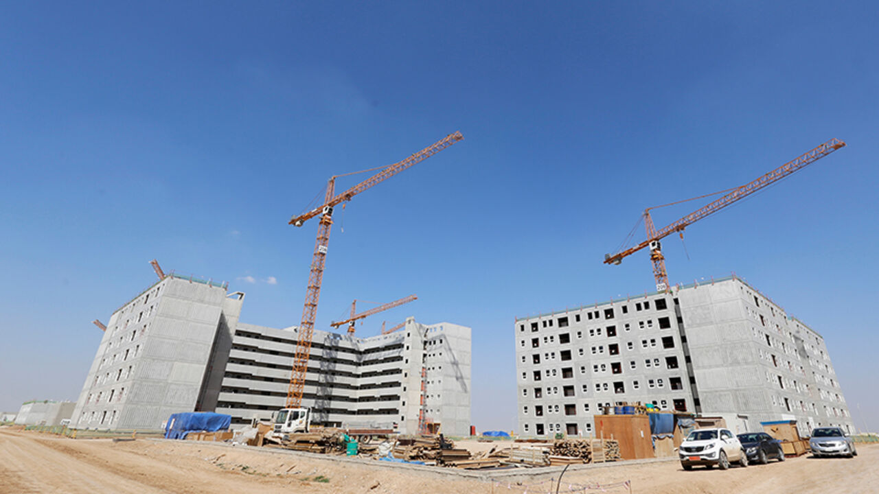 A general view of the buildings at Bismayah residential project in Baghdad, February 26, 2015. On a main highway south of Baghdad, dozens of buildings rise up from the Iraqi plains, the first blocks of a multi-billion-dollar city emerging from a landscape more accustomed to conflict and crisis than glitzy new development. Bismayah New City, which aims to house half a million people within four years, dwarfs any construction project Iraq has attempted in a generation. Picture taken February 26, 2015.  REUTER