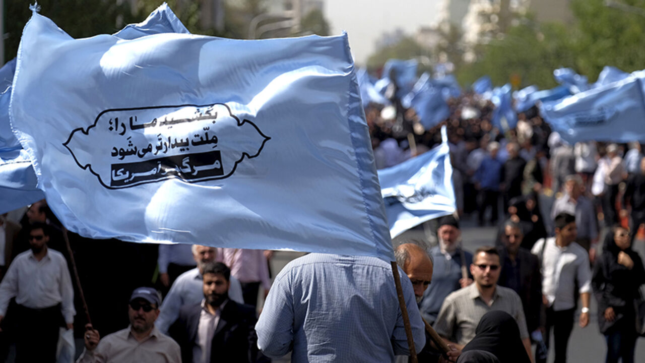 SAUDI-HAJ/IRAN Mourners attend the funeral of victims killed in Saudi Arabia during a stampede at the haj pilgrimage, in Tehran October 4, 2015. More than 464 Iranian nationals were killed in last month's crush in Mina, Saudi Arabia, Iran's Haj Organization says. Iranian officials have alleged the overall total death toll is more than 1,000. Saudi Arabia has confirmed the deaths of 769 people. The banner reads, "Kill our nation, our nation becomes more awake. Down with the U.S."REUTERS/Raheb Homavandi/TIMAATTENTION EDITOR