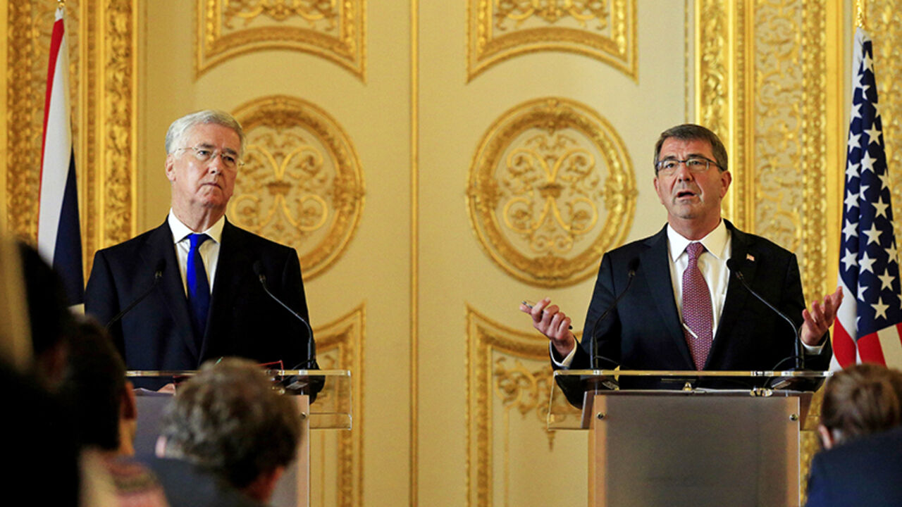 MIDEAST-CRISIS/SYRIA-USA U.S. Defence Secretary Ashton Carter (R) speaks during a news conference with his British counterpart Michael Fallon at Lancaster House in London, Britain October 9, 2015. U.S. President Barack Obama will overhaul Washington's approach to supporting Syrian rebel forces following this year's deeply troubled launch of a U.S. military training program, Carter said on Friday. REUTERS/Jonathan Brady/pool - RTS3QRE