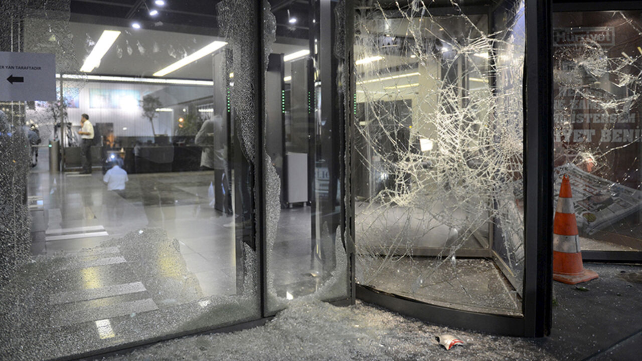 MIDEAST-CRISIS/TURKEY-PKK Smashed glass is seen at the damaged entrance of the headquarters of the Hurriyet daily newspaper in Istanbul, Turkey, September 8, 2015. Turkish Prime Minister Ahmet Davutoglu appealed for calm on Tuesday after crowds angered by renewed Kurdish militant violence attacked newspapers and offices of a pro-Kurdish political party. The unrest took place after Kurdish militants killed 15 police officers in two bombings in eastern Turkish provinces. The PKK attacks have triggered nationalist anger against Kurds.