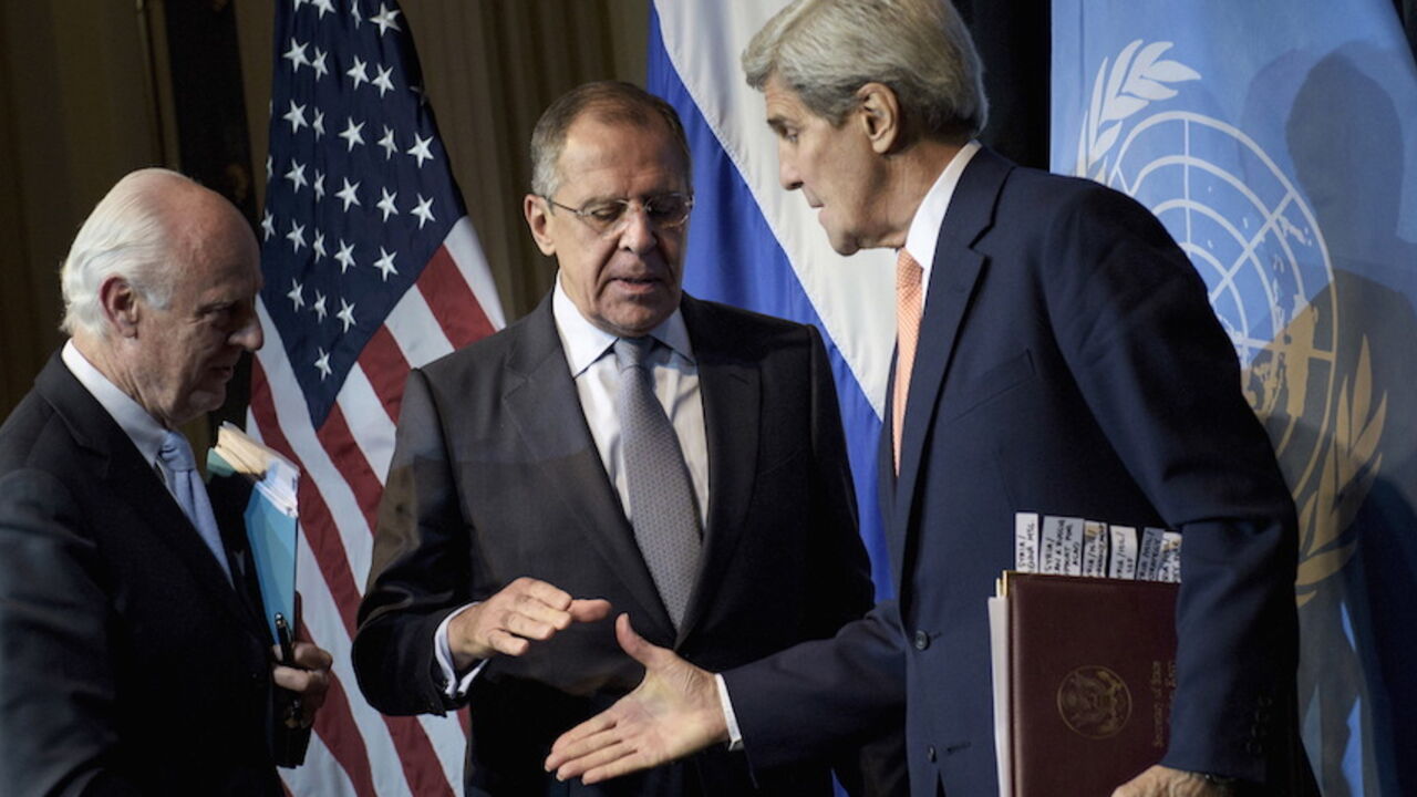 MIDEAST-CRISIS-SYRIA-KERRY UN Special Envoy for Syria Staffan de Mistura (L) watches as Russian Foreign Minister Sergei Lavrov (C) and US Secretary of State John Kerry shake hands after a news conference at the Grand Hotel, in Vienna, October 30, 2015. U.S. Secretary of State John Kerry said on Friday he hoped progress could be made at international talks in Vienna aimed at finding a political solution to Syria's four-year-old civil war but it would be very difficult. REUTERS/Brendan Smialowski/Pool - RTX1U16S