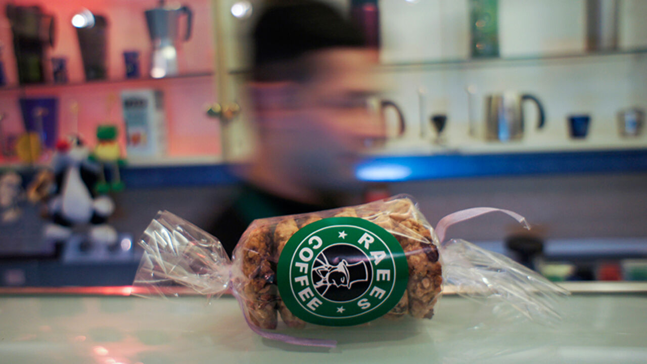 COFFEE-IRAN/SOCIAL A product showing the Raees Coffee logo is seen on the counter at a branch of the coffee chain in central Tehran February 5, 2011. In a country where there are no bars, as alcohol is banned, Tehran's Raees Coffee chain has proved popular since its first cafe opened in December 2001, offering both a modern environment, complete with wireless Internet access, and - a first in Iran - takeaway coffee. Many other coffee shops have sprung up in Iran's major cities where, until recently, tea was the beverage of ch