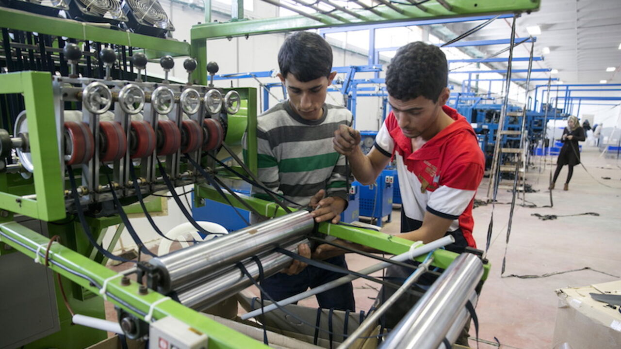 ISRAEL-EU/LABELLING Palestinians work at a textile factory in the Industrial Park of the West Bank Jewish settlement of Barkan, southwest of Nablus November 8, 2015. Few issues have caused more friction between Israel and the European Union than EU plans to impose labeling on goods produced in Jewish settlements on occupied land. And if Israel is right about the timing, the tensions could get worse. Picture taken November 8, 2015. REUTERS/Baz Ratner - RTS6C3O