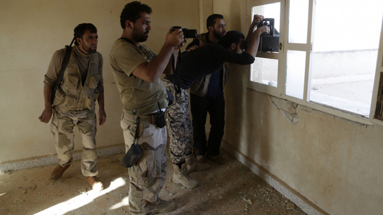 MIDEAST-CRISIS/SYRIA Free Syrian Army fighters of the 101 Division, monitor the movements of the forces loyal to Syria's President Bashar al-Assad near al-Tamana town in the southern countryside of Idlib, Syria October 14, 2015. Fares al-Bayoush, a former Syrian army colonel who heads the Fursan al-Haq group, spoke of a battery of TOW missile platforms stretching east along the frontline from Kafr Nabuda to the village of Maan. The aim is to stop government forces advancing north from Morek to rebel-held Khan Shaykhoun, both to