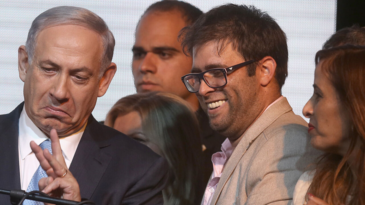 Nic6459621 A picture dated on March 18, 2015 shows Israel's deputy parliament speaker, lawmaker Oren Hazan (2nd R) standing next to Israeli Prime Minister Benjamin Netanyahu (L) as they wait for exit polls in Israel's parliamentary elections in Tel Aviv. Hazan, has said he will sue privately owned Channel 2 over a report alleging his involvement in pimping and drugs. Channel 2 ran an investigative report on June 8, 2015 alleging that Hazan, who used to run a casino in Bulgaria, had arranged to provide casino-goers wit