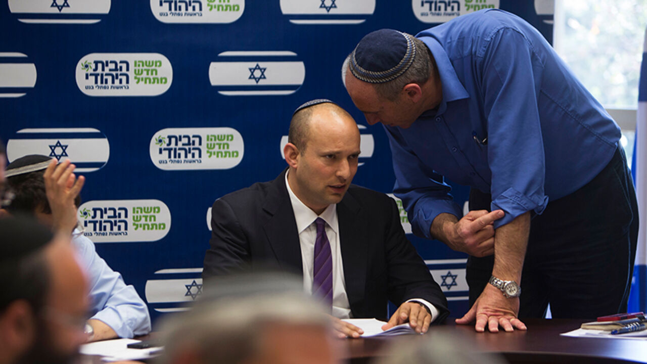 ISRAEL-POLITICS/ Naftali Bennett (C), attends a Jewish Home party meeting, at the Knesset, the Israeli parliament, in Jerusalem March 4, 2013. A surprise alliance between Israeli political stars, far-right Bennett, and centrist Yair Lapid, who reject privileges for ultra-orthodox Jews is frustrating Prime Minister Benjamin Netanyahu's efforts to form a new government. REUTERS/Ronen Zvulun (JERUSALEM - Tags: POLITICS) - RTR3EK9R