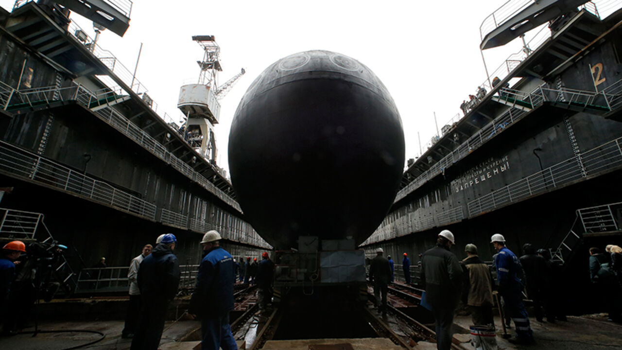 RUSSIA/ People attend a ceremony launching the diesel-electric submarine "Rostov-on-Don" at the Admiralty Shipyards in St. Petersburg, June 26, 2014. "Rostov-on-Don" produced under Project 636.3 is the second serial submarine being built by OJSC Admiralty Shipyards for Russia's Black Sea Fleet. REUTERS/Alexander Demianchuk (RUSSIA - Tags: MILITARY TPX IMAGES OF THE DAY) - RTR3VUFV
