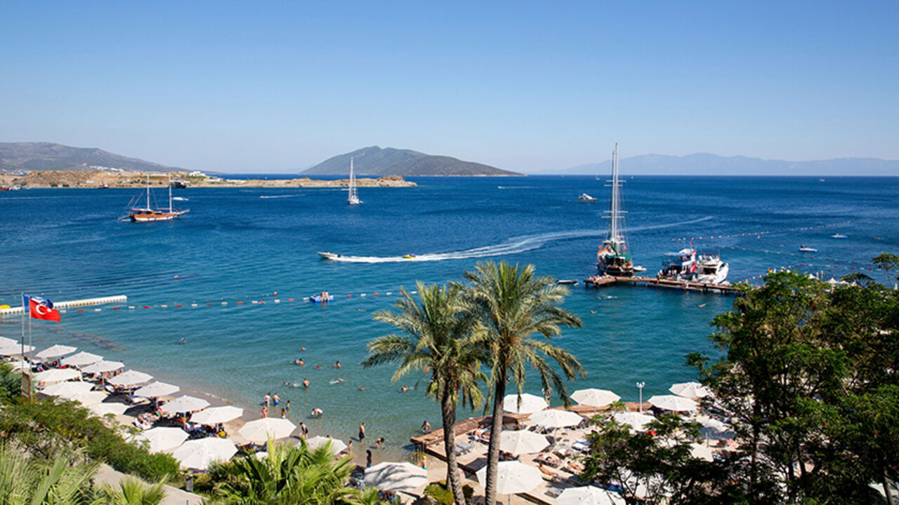 TURKEY-ELECTION/BODRUM Holidaymakers rest at a beach in the resort town of Bodrum July 14, 2014. As families splash in the sea and lounge in the sun, thoughts of politics and civic duty are a world away for most Turks holidaying on the Aegean and Mediterranean coasts. Only the most committed opponents of Prime Minister Tayyip Erdogan leave the beach to queue in a sweltering council building nearby to register to vote in next month's presidential election to prevent what they see as the country's slide towards authoritarianism. Th