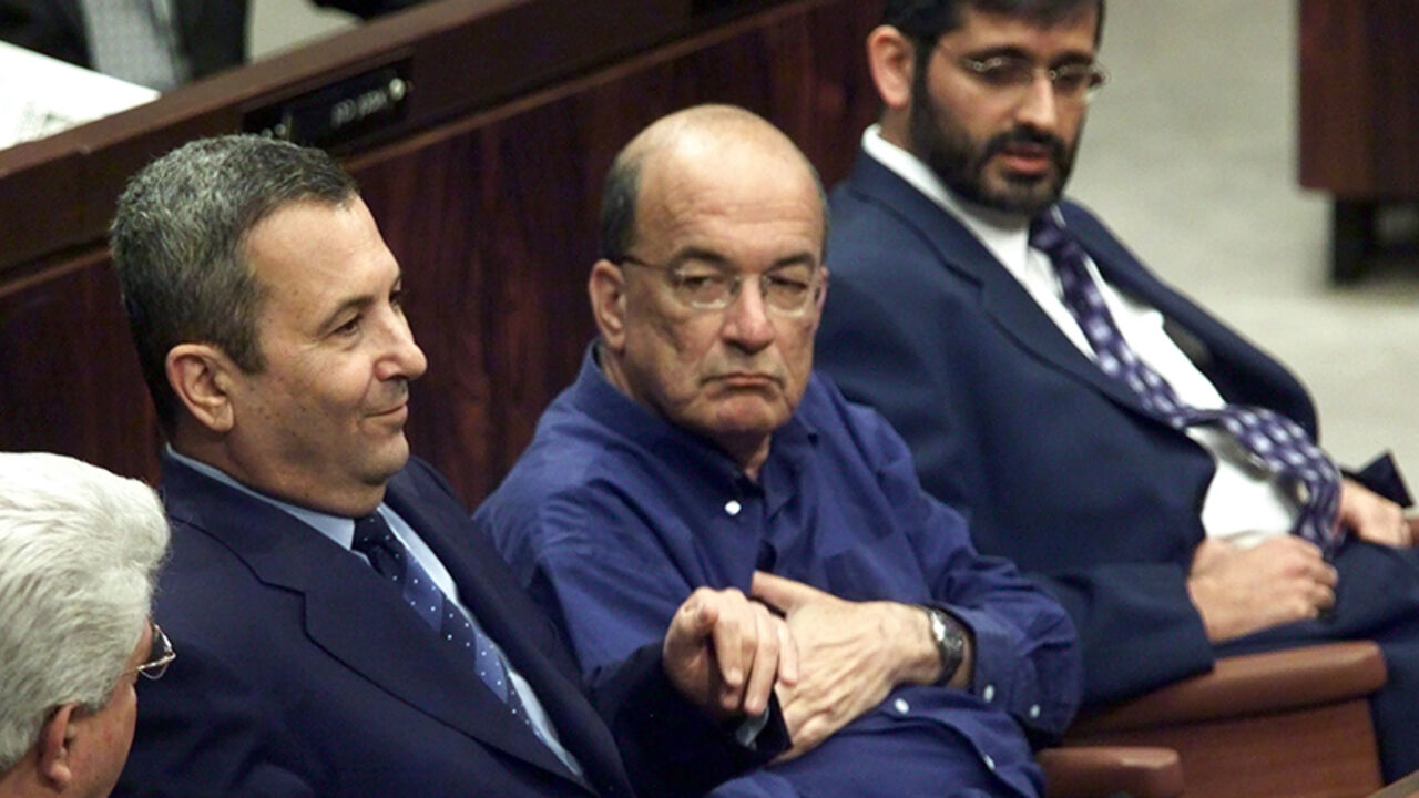ISRAEL BARAK FILE PHOTO 7JUN00 - Israeli Prime Minister Ehud Barak (L) sitting with the leaders of the Meretz party, Yossi Sarid (C) and the ultra-Orthodox Shas party, Eli Yishai (R) as a vote is taken sponsored by the opposition calling for new elections. Barak lost the vote with the Shas party voting against the coalition government. Today June 13 the Shas party quit Barak's ruling coalition government over educational funds it has not received. The 17-member Shas party Knesset members are expected to submit their res