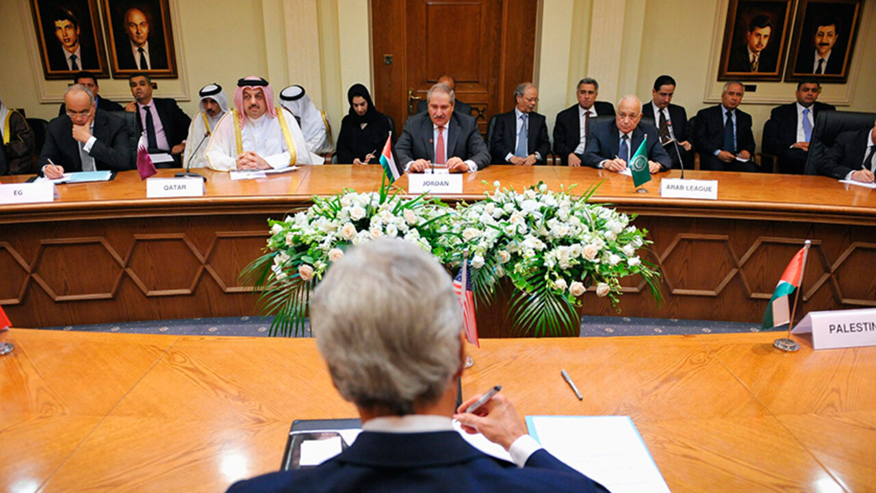 PALESTINIANS-ISRAEL/KERRY U.S. Secretary of State John Kerry (back to camera) meets with the Arab League Peace Initiative at the Ministry of Foreign Affairs in Amman, July 17, 2013. Kerry is due to meet on Wednesday with officials from Arab nations that he regards as essential to his push to get Israelis and Palestinians to resume peace talks. REUTERS/Mandel Ngan/Pool (JORDAN - Tags: POLITICS) - RTX11P6I