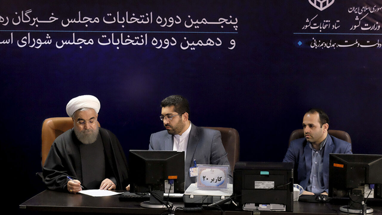 IRAN-ELECTION/ Iranian President Hassan Rouhani (L) registers for February's election of the Assembly of Experts, the clerical body that chooses the supreme leader, at the Interior Ministry in Tehran December 21, 2015. REUTERS/Raheb Homavandi/TIMA ATTENTION EDITORS - THIS IMAGE WAS PROVIDED BY A THIRD PARTY. FOR EDITORIAL USE ONLY. - RTX1ZKJH