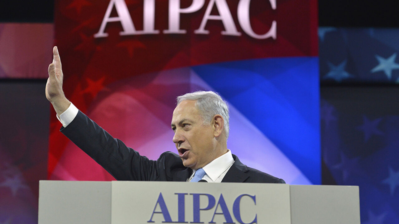 IRAN-NUCLEAR/NETANYAHU Israeli Prime Minister Benjamin Netanyahu acknowledges applause as he arrives to address the American Israel Public Affairs Committee (AIPAC), in Washington, March 4, 2014. Netanyahu urged world powers on Tuesday not to allow Iran to retain the ability to enrich uranium, saying it must be stripped of all nuclear technologies with bomb-making potential. REUTERS/Mike Theiler (UNITED STATES - Tags: POLITICS TPX IMAGES OF THE DAY) - RTR3G15H