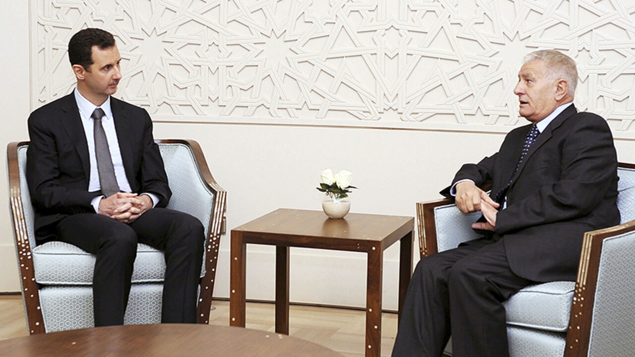 SYRIA-CRISIS/ Syria's President Bashar al-Assad (L) meets Abbas Zaki, the personal envoy of the Palestinian President Mahmoud Abbas, in Damascus, in this handout photograph distributed by Syria's national news agency SANA on October 7, 2013. REUTERS/SANA/Handout via Reuters (SYRIA - Tags: POLITICS) ATTENTION EDITORS - THIS IMAGE WAS PROVIDED BY A THIRD PARTY. FOR EDITORIAL USE ONLY. NOT FOR SALE FOR MARKETING OR ADVERTISING CAMPAIGNS. THIS PICTURE IS DISTRIBUTED EXACTLY AS RECEIVED BY REUTERS, AS A SERVICE TO CLIENTS -