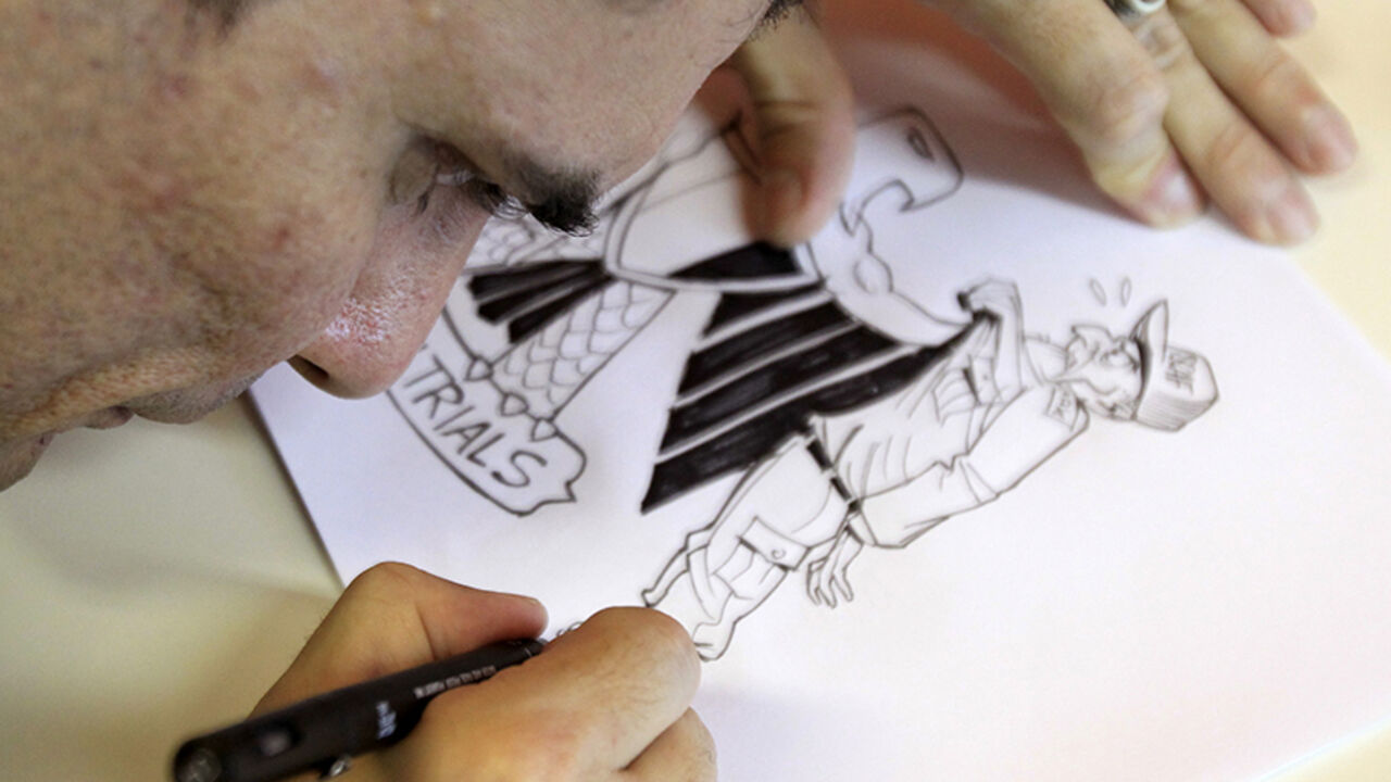BRAZIL-CARTOONIST/MIDEAST Brazilian cartoonist Carlos Latuff finalizes a cartoon after an interview with Reuters in Rio de Janeiro August 26, 2011. Latuff, a 42-year-old leftist whose only family link to the Middle East is a Lebanese grandfather he never knew, has become a hero of the tumultuous Arab Spring with rapid-fire satirical sketches that have helped inspire the uprisings. All he has needed is his pen, a passion for the region's struggles and a Twitter account. Starting with the Tunisia uprisings last December, Latuff's work