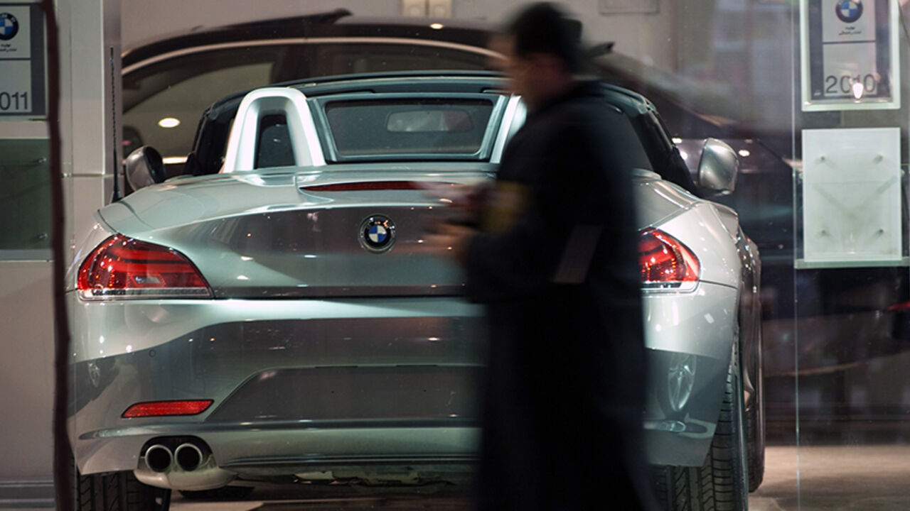 IRAN/ EDITORS' NOTE: Reuters and other foreign media are subject to Iranian restrictions on leaving the office to report, film or take pictures in Tehran.
An Iranian man walks past a BMW displayed at a car shop in central Tehran March 1, 2012. REUTERS/Morteza Nikoubazl (IRAN - Tags: SOCIETY BUSINESS TRANSPORT)