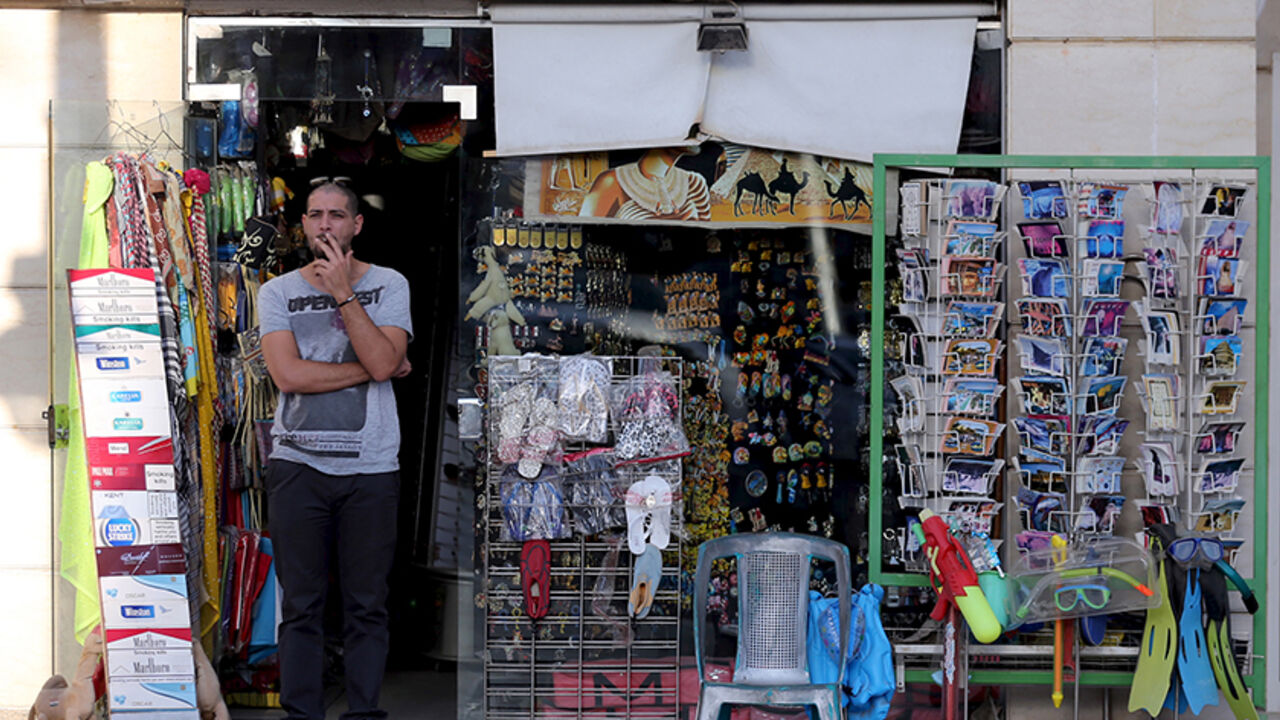 A shopkeeper waits for tourists at a souvenir shop in the Red Sea resort of Hurghada, Egypt, January 9, 2016. Two armed assailants attacked the hotel in the Egyptian Red Sea resort town of Hurghada on Friday, wounding three foreign tourists, Egyptian officials said. REUTERS/Mohamed Abd El Ghany - RTX21N1S