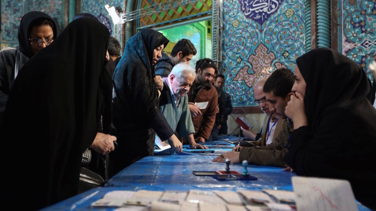 AFP_895IR Iranian voters queue to cast their vote for both parliamentary elections and the Assembly of Experts at polling station in Tehran on February 26, 2016.
Iranians began voting across the country in elections billed by the moderate president as vital to curbing conservative dominance in parliament and speeding up domestic reforms after a nuclear deal with world powers. / AFP / ATTA KENARE (Photo credit should read ATTA KENARE/AFP/Getty Images)