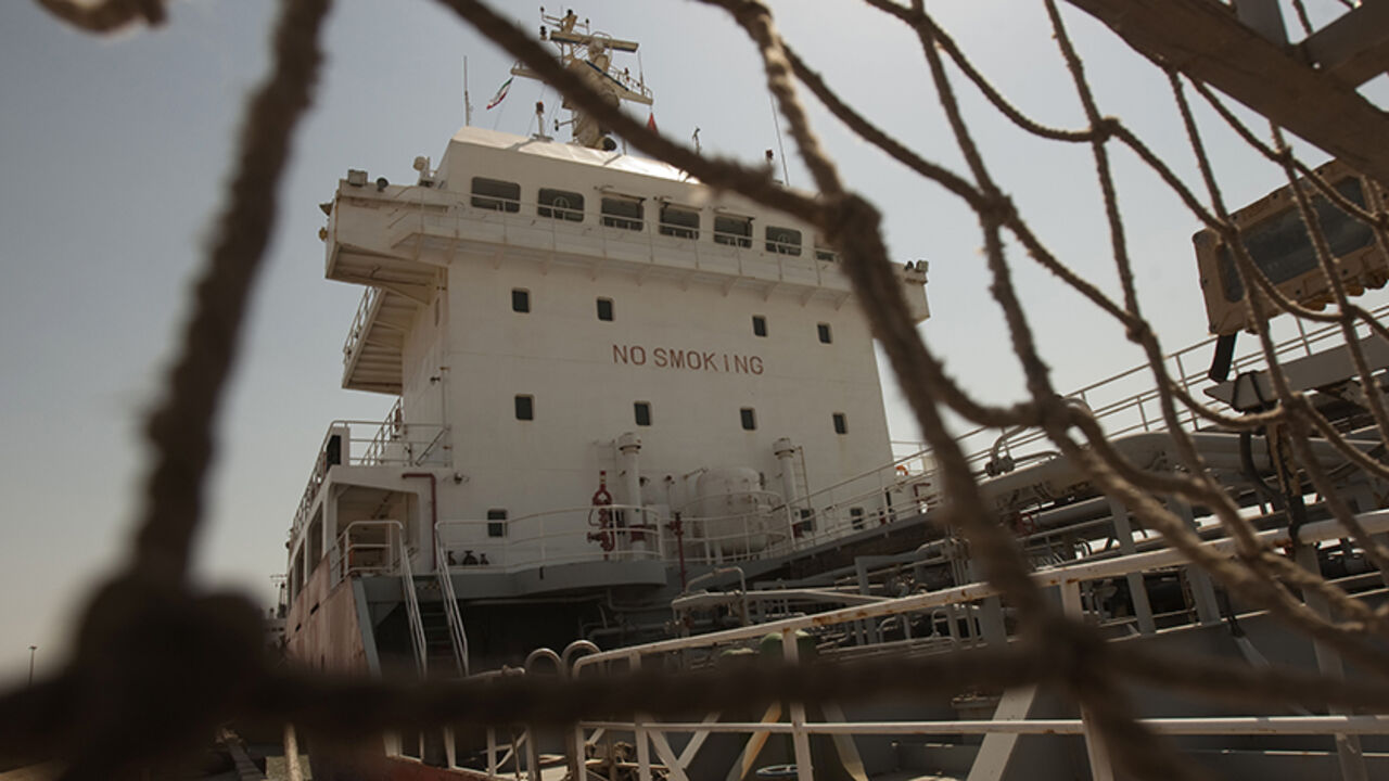 IRAN/ A ship docks at the Bandar Imam Khomeini port in Khuzestan province,1032 km (641 miles) southwest of Tehran, September 28, 2011. REUTERS/Raheb Homavandi (IRAN - Tags: BUSINESS) - RTR2RYWD