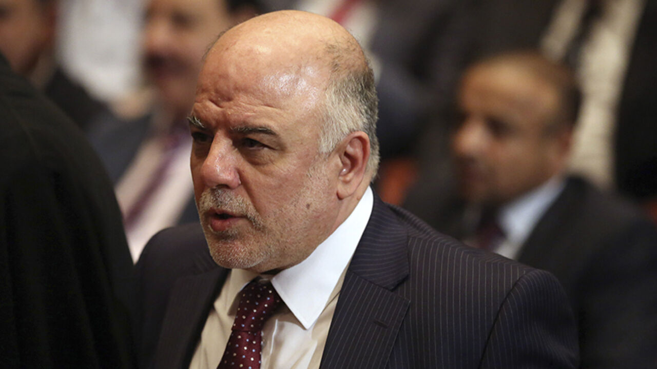 IRAQ-CRISIS/POLITICS Iraq's new Prime Minister Haider al-Abadi attends the Parliament session to submit his government in Baghdad September 8, 2014. Iraq's parliament approved a new government headed by Haider al-Abadi as prime minister on Monday night, in a bid to rescue Iraq from collapse, with sectarianism and Arab-Kurdish tensions on the rise. REUTERS/Hadi Mizban/Pool (IRAQ - Tags: POLITICS) - RTR45G2T