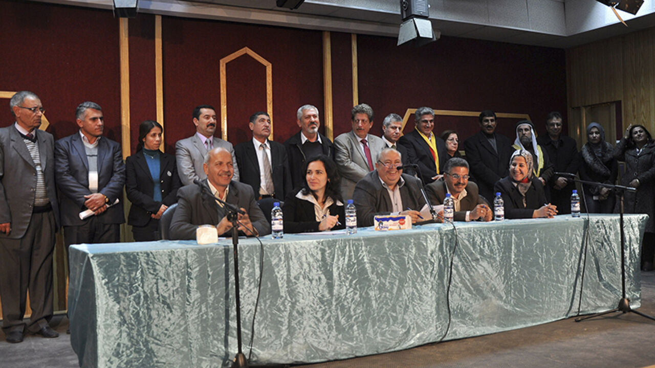 SYRIA-CRISIS/KURDS Members of the interim government of democratic self-administered party stand after declaring a provincial government, in the city of Amuda near Hasaka January 21, 2014. Kurds in Syria declared a provincial government in the north of the country on Tuesday, consolidating their geographic and political presence on the eve of peace talks in Switzerland at which they will not be represented. The municipal council will run affairs in one of three administrative districts set up by Kurds, who have seized upon t