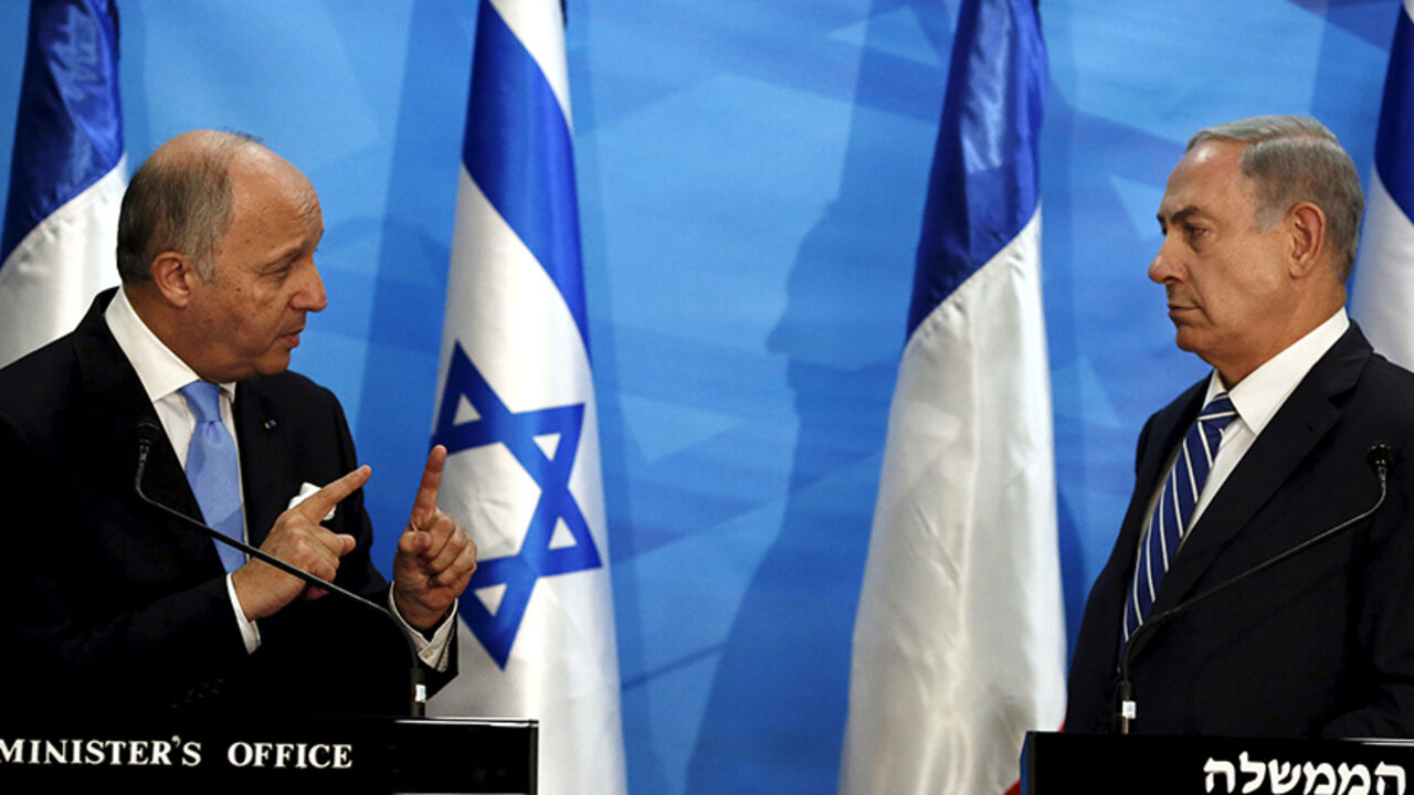 ISRAEL-PALESTINIANS/FRANCE Israel's Prime Minister Benjamin Netanyahu (R) and France's Foreign Minister Laurent Fabius deliver statements in Jerusalem June 21, 2015. Netanyahu prefaced talks about a French-led peace initiative on Sunday by saying foreign powers were trying to dictate to Israel a deal with the Palestinians. Fabius is promoting a French-led initiative that would see the Israeli-Palestinian peace process, which collapsed in 2014, relaunched through an international support group comprising Arab states, the European Unio
